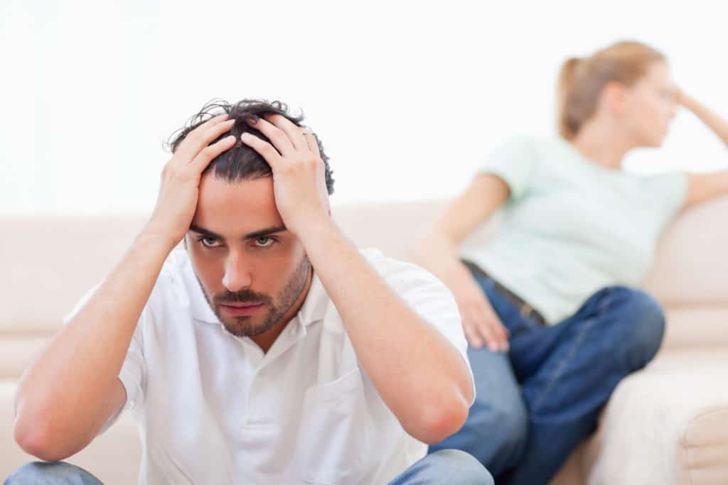 man stressed out with wife and struggling relationship